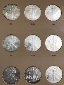 1986-2020 Lot de 35 pièces de dollars American Eagle en qualité brillant universel (BU) dans un album Delux Dansco.