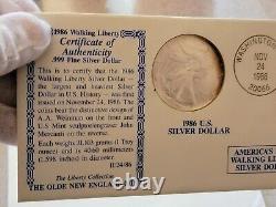En français, le titre serait : 'Rouleau de 20 plus 1 BU 1986 American Silver Eagle, 21 pièces, tube orange, $1 U.S. Mint'