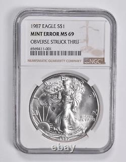 Erreur De Menthe Ms69 1987 American Silver Eagle Obv Struck Thru Ngc 3698