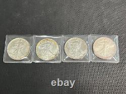 Lot de 4 American Silver Eagles de 1986, 1987, 1988, 1989, 1 once, en argent fin .999