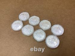 Lot de 8 pièces d’argent American Silver Eagle de 1 oz, États-Unis, 2005