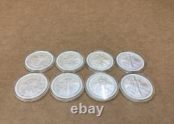 Lot de 8 pièces d’argent American Silver Eagle de 1 oz, États-Unis, 2005