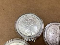 Lot de 8 pièces d’argent American Silver Eagle de 1 oz, États-Unis, 2005