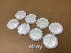 Lot de 8 pièces d’argent American Silver Eagle de 1 oz, États-Unis, 2005